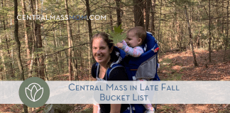 Woman Hiking with baby in backpack on Central Mass in Late Fall Bucket List Hike