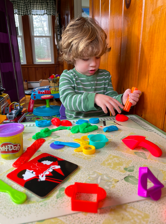 You're Less Alone Than You Think - Kid playing with playdough