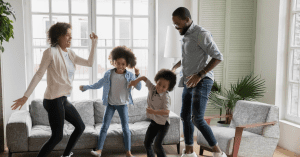 parents and kids finding joy while dancing in their living room