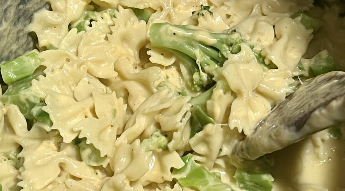 A pot of creamy instant pot mac & cheese with broccoli