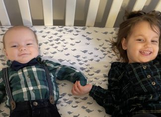 siblings holding hands, going from one child to two