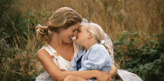mother cuddling with daughter, parenting advice