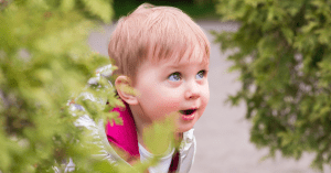 toddler looking with wonder at something outside