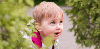 toddler looking with wonder at something outside