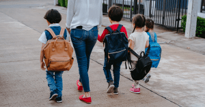 mom walking with her four kids