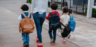 mom walking with her four kids