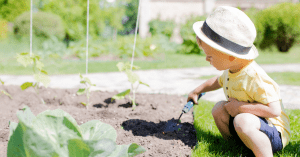 toddler digging in the dirt