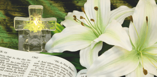 a cross, easter lilies and a bible, to teach kids about easter