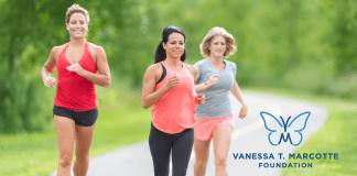 women running helping each other stay safe and motivated