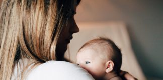 I Will Always Want One More … I Think mom holding her nerborn, wondering, is my family complete?
