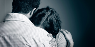couple embracing after pregnancy loss