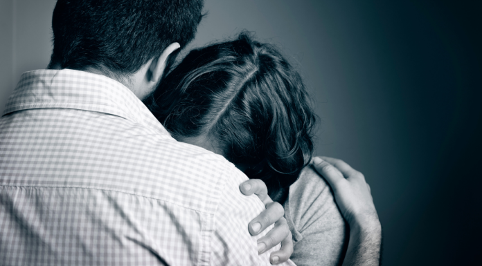 couple embracing after pregnancy loss