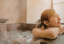 woman sitting in a hot tub relaxing