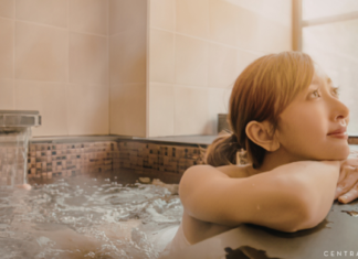 woman sitting in a hot tub relaxing