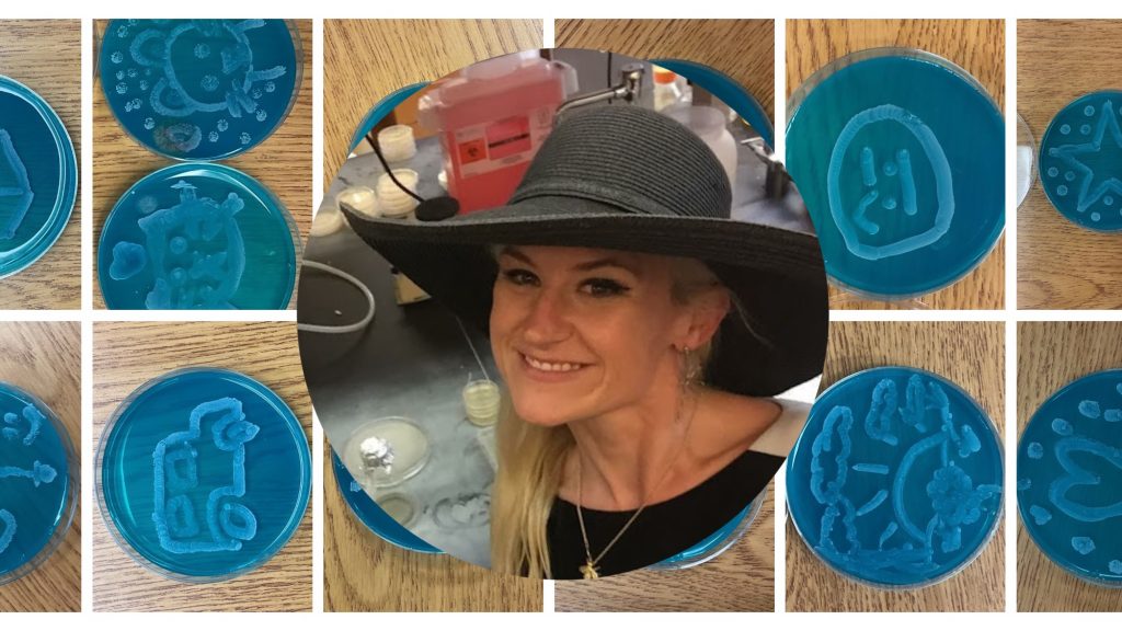 Dr. Anne A. Madden wearing a black wide-brimmed hat in a laboratory. Overlayed on teal Petri dishes with various drawn images on them in baker's yeast.