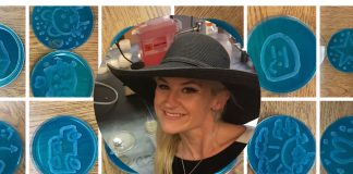 Dr. Anne A. Madden wearing a black wide-brimmed hat in a laboratory. Overlayed on teal Petri dishes with various drawn images on them in baker's yeast.