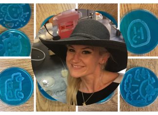 Dr. Anne A. Madden wearing a black wide-brimmed hat in a laboratory. Overlayed on teal Petri dishes with various drawn images on them in baker's yeast.