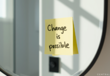 Post-it note on a mirror with a flip-the-script mantra for mental health.