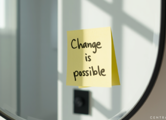 Flip the Script: A Mindset Reset This Mental Health Awareness Month Post-it note on a mirror with a flip-the-script mantra for mental health.