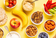 spread of healthy snacks like fruits, vegetables and crackers.