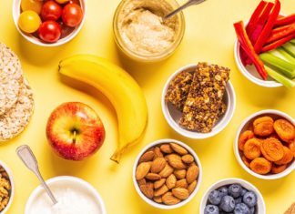 spread of healthy snacks like fruits, vegetables and crackers.